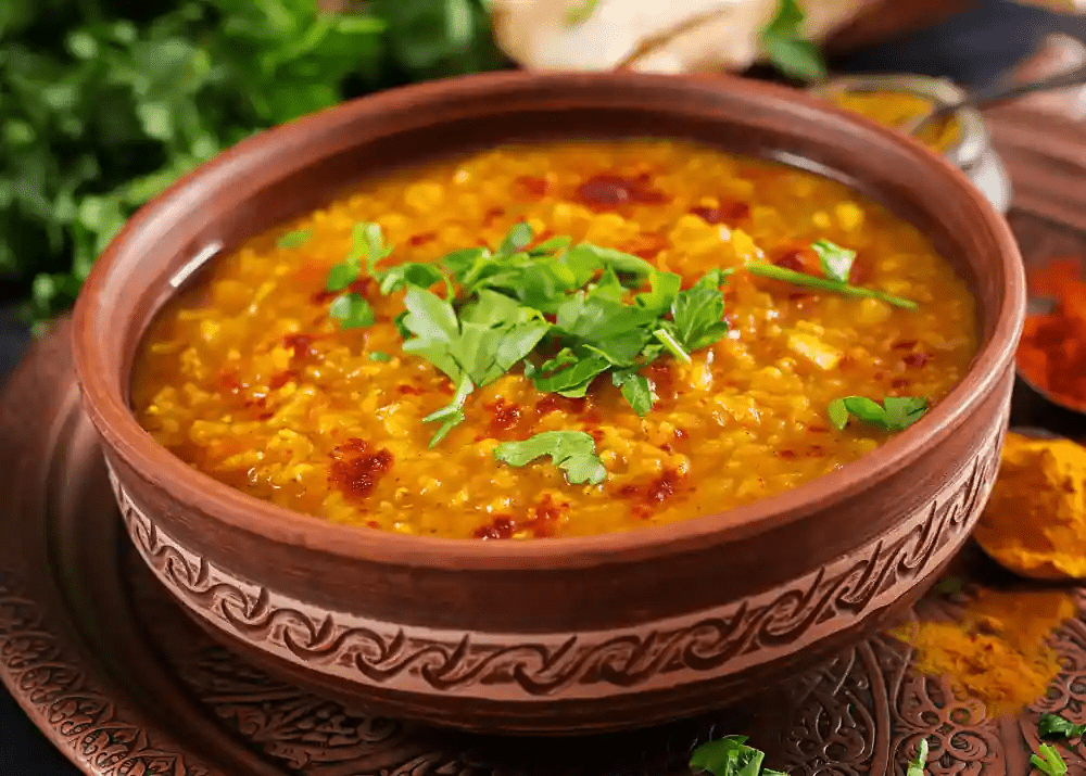 dal khichdi in bowl topping with coriander leaves